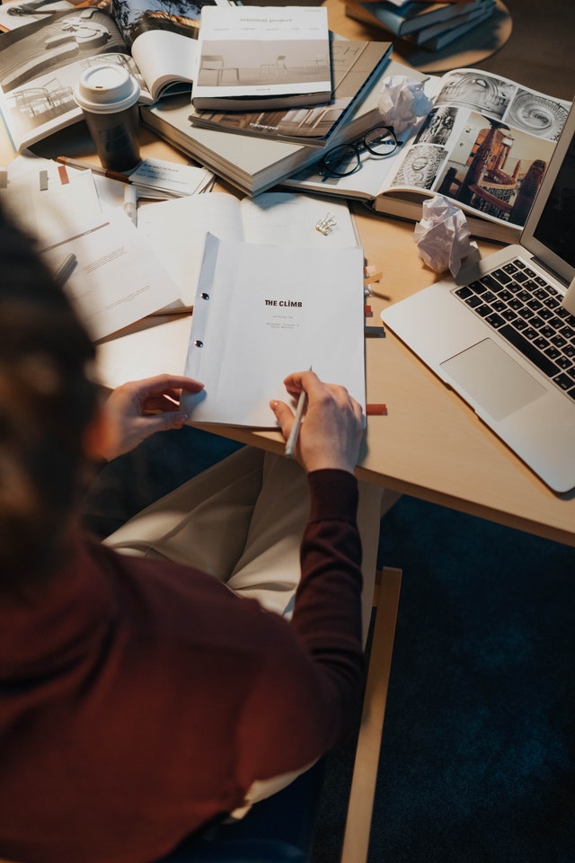 person-holding-white-printer-paper